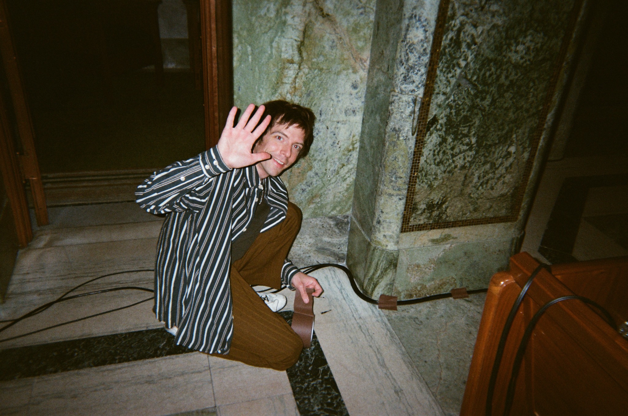 Event participant waving inside the chapel