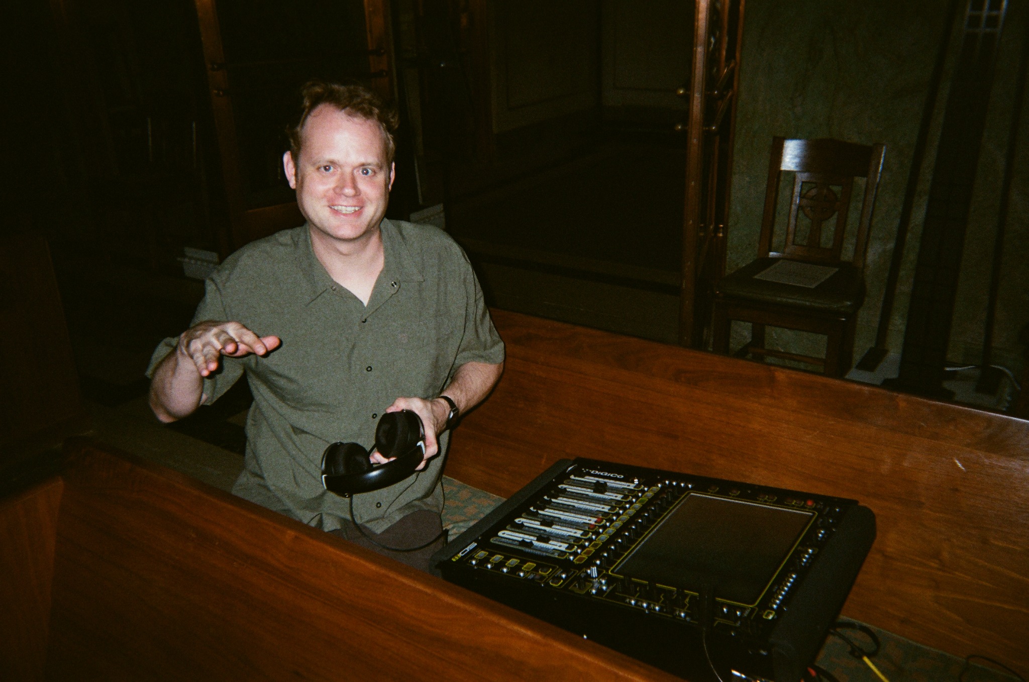 Sound technician at the mixing console inside the chapel