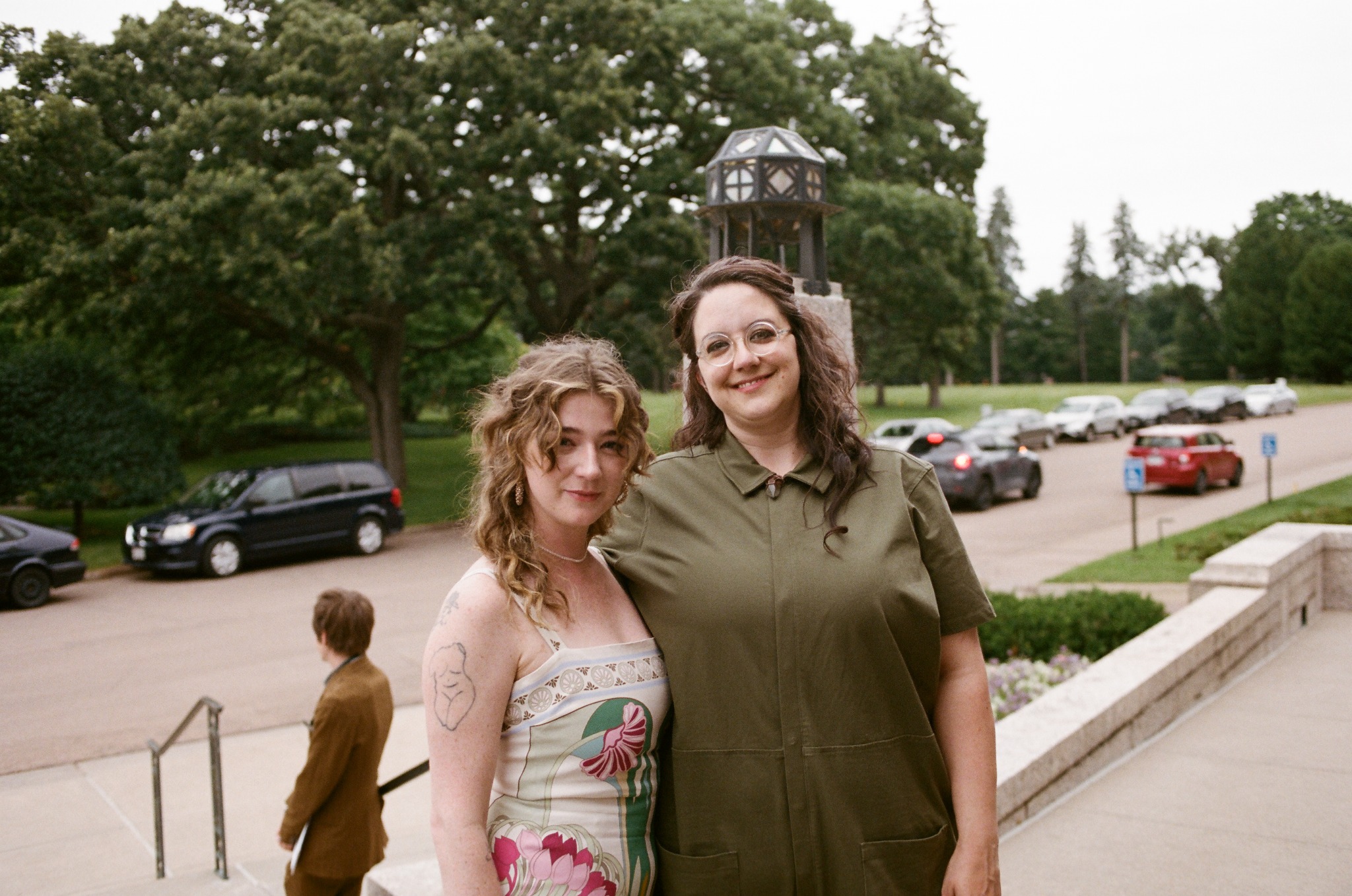 Two event participants standing on the chapel steps