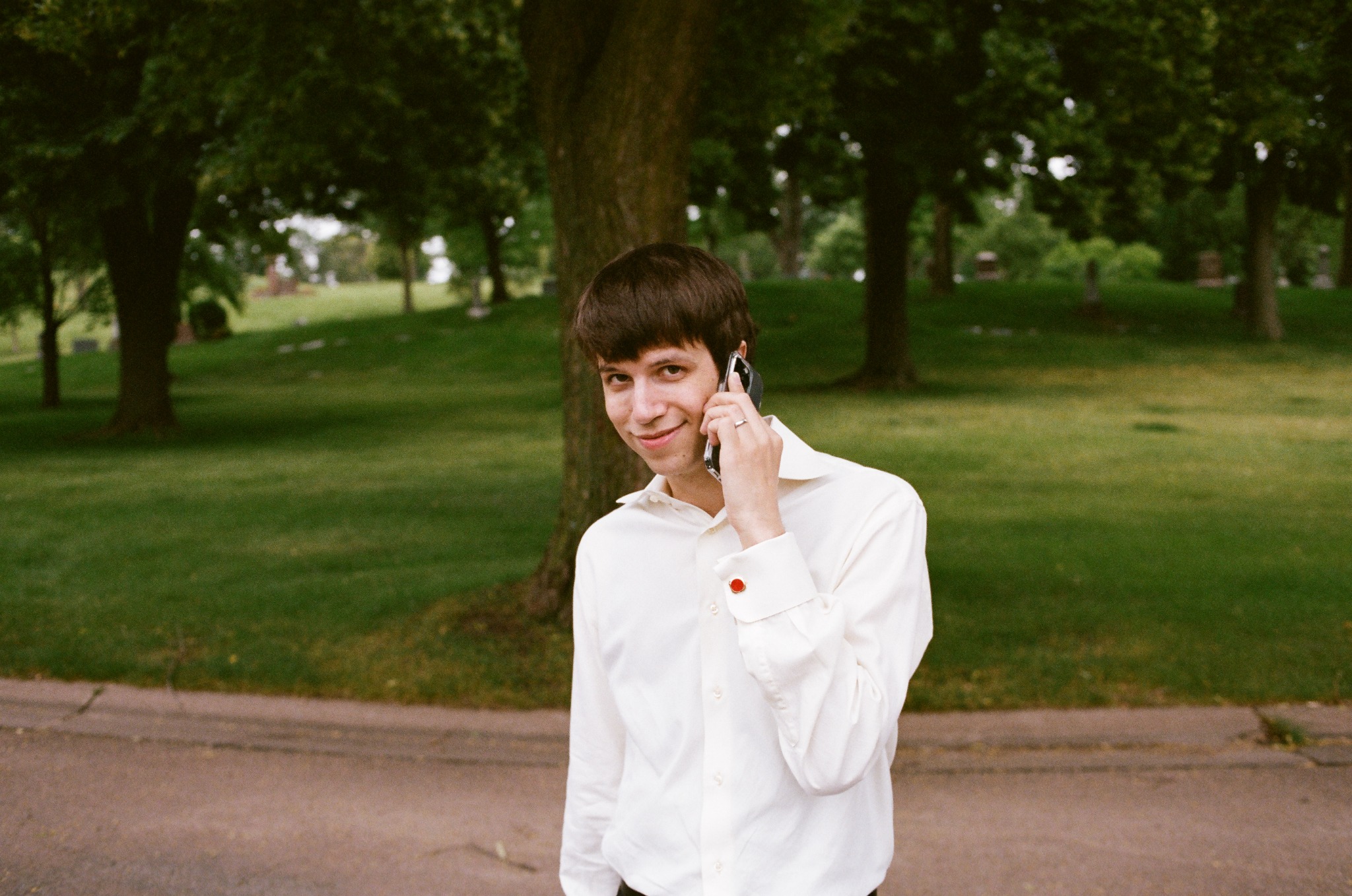 Event participant speaking on a phone outside