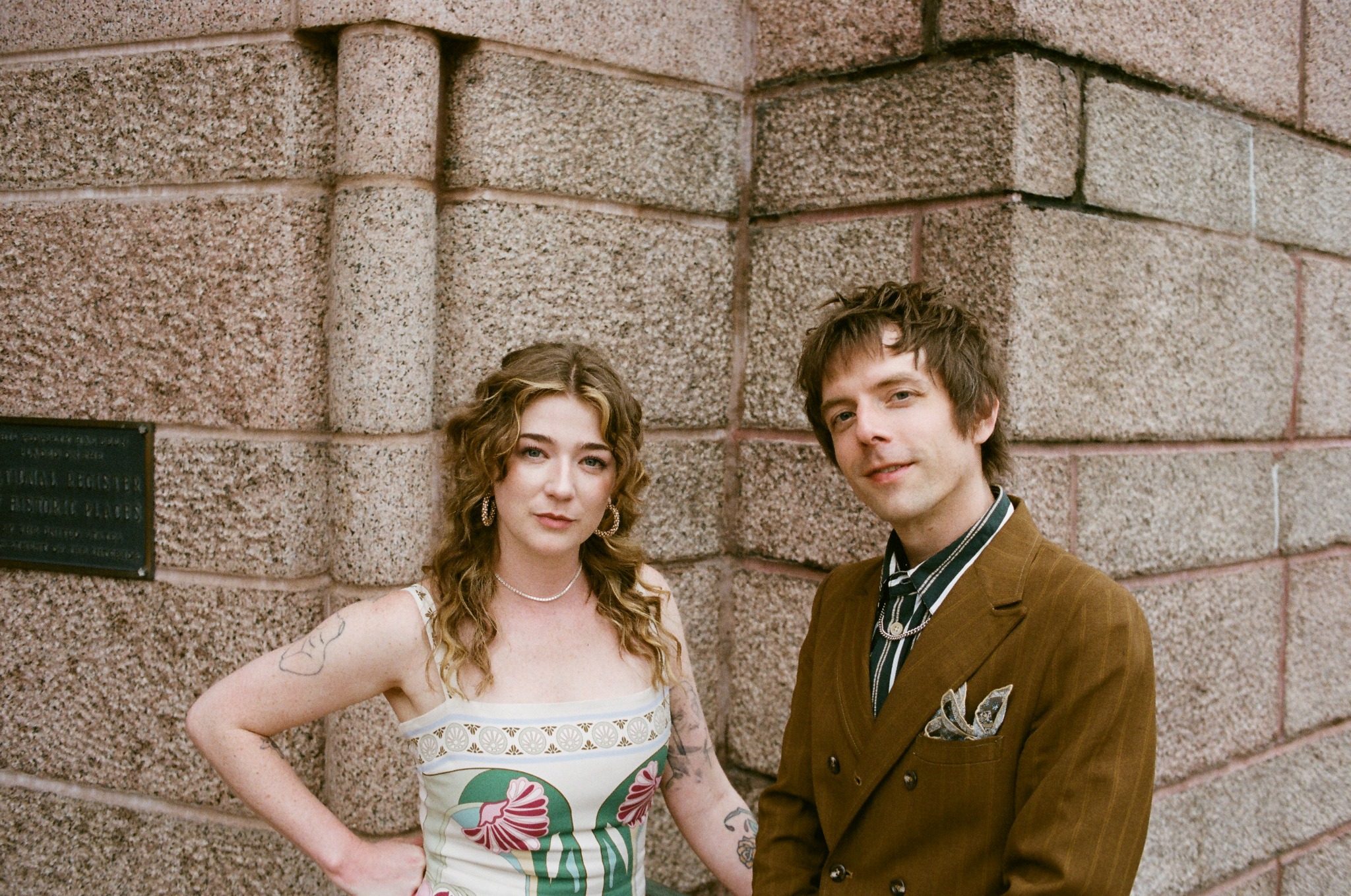 Two event participants standing outside the chapel